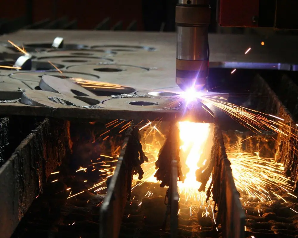 A machine cutting metal with sparks flying