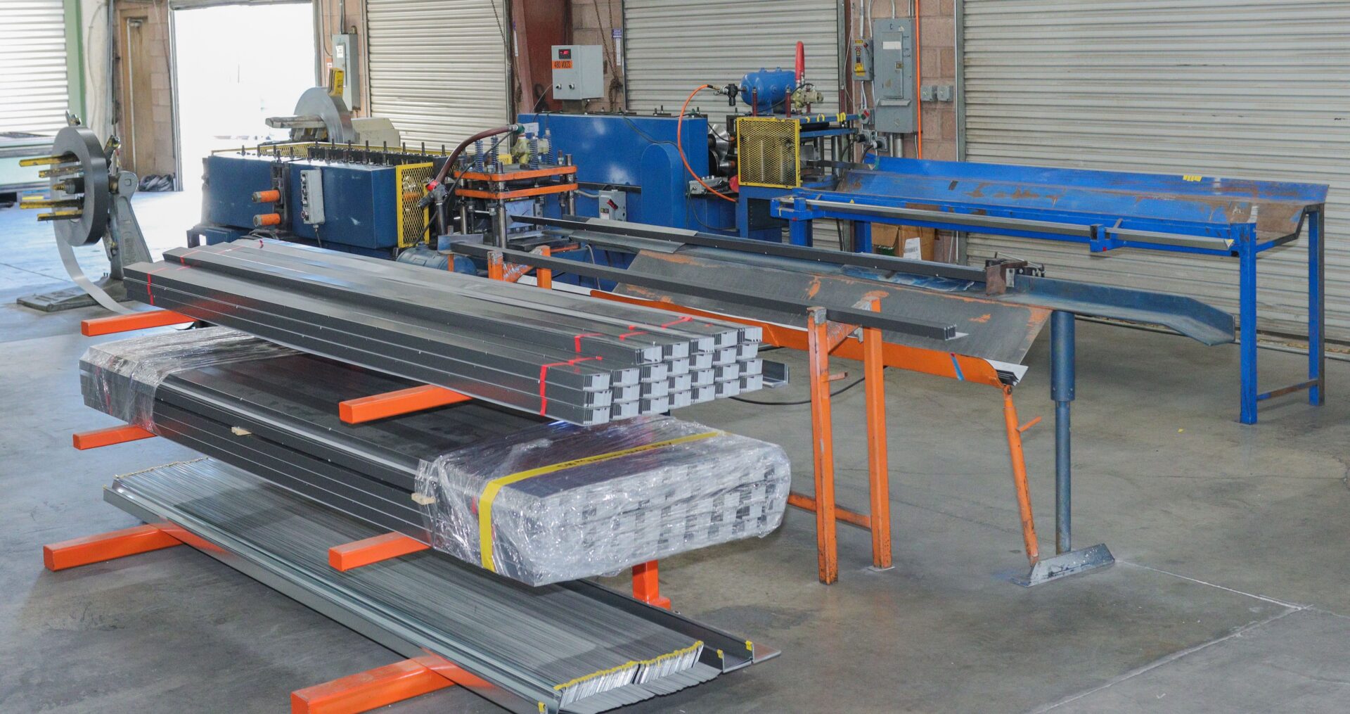 A warehouse filled with metal pipes and tubes.