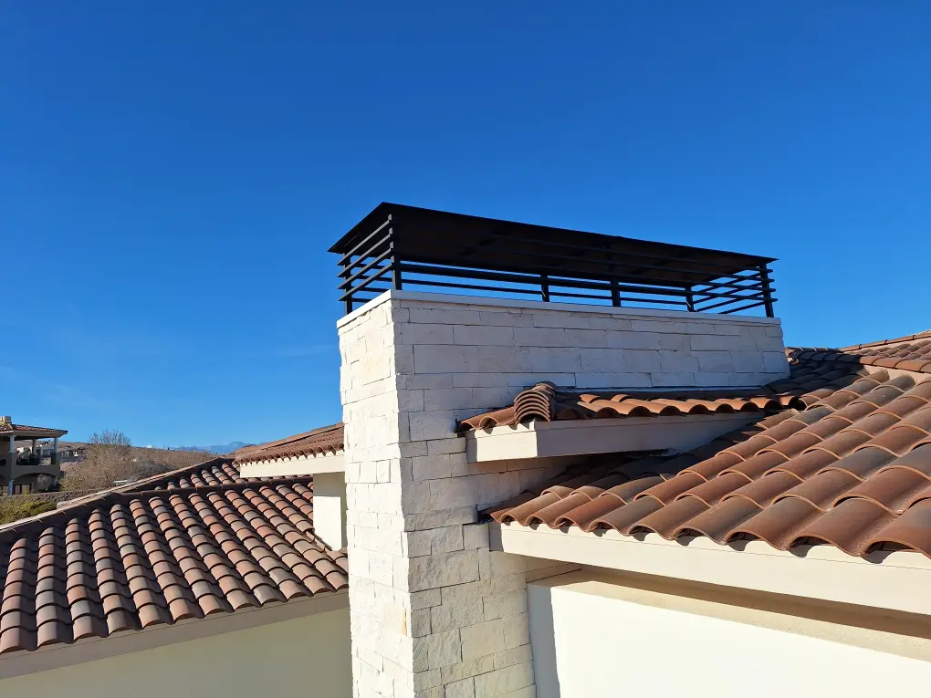 A roof top with a metal railing on it